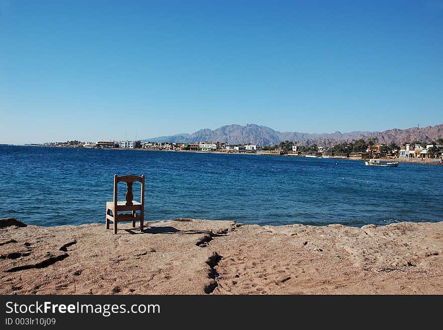 Empty Chair Near The Sea.