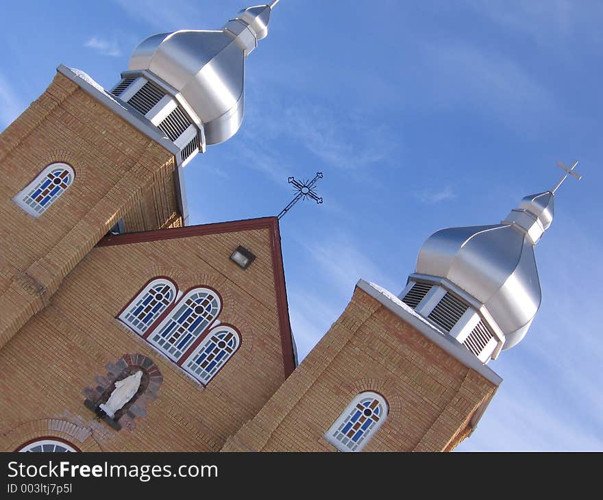 This image depicts a Ukrainian-style church at an angle. This image depicts a Ukrainian-style church at an angle.