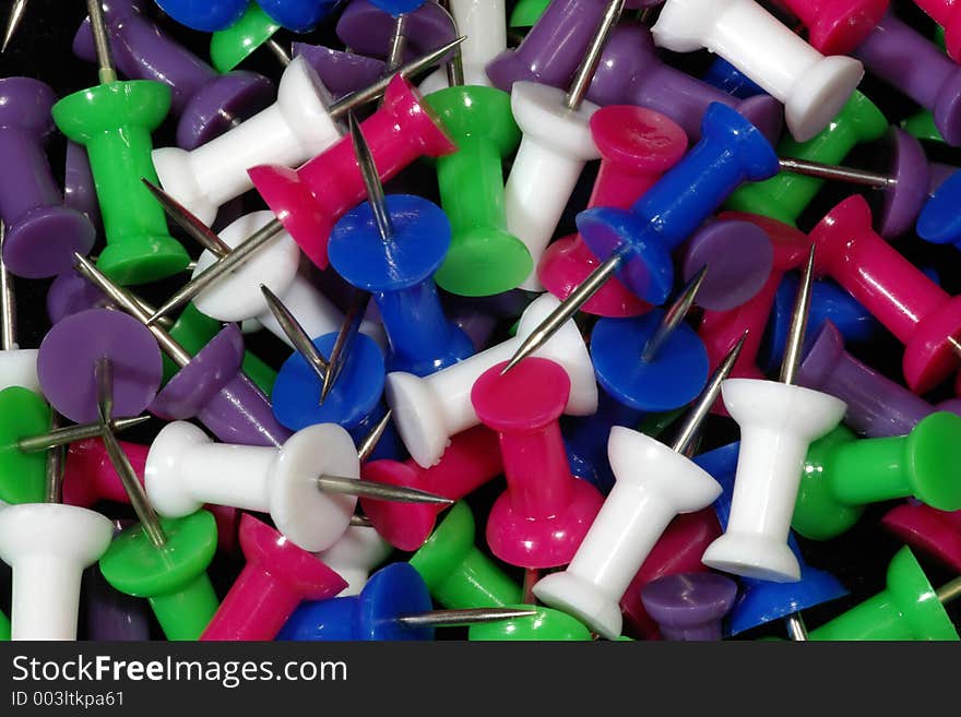 A melange of brightly colored pushpins