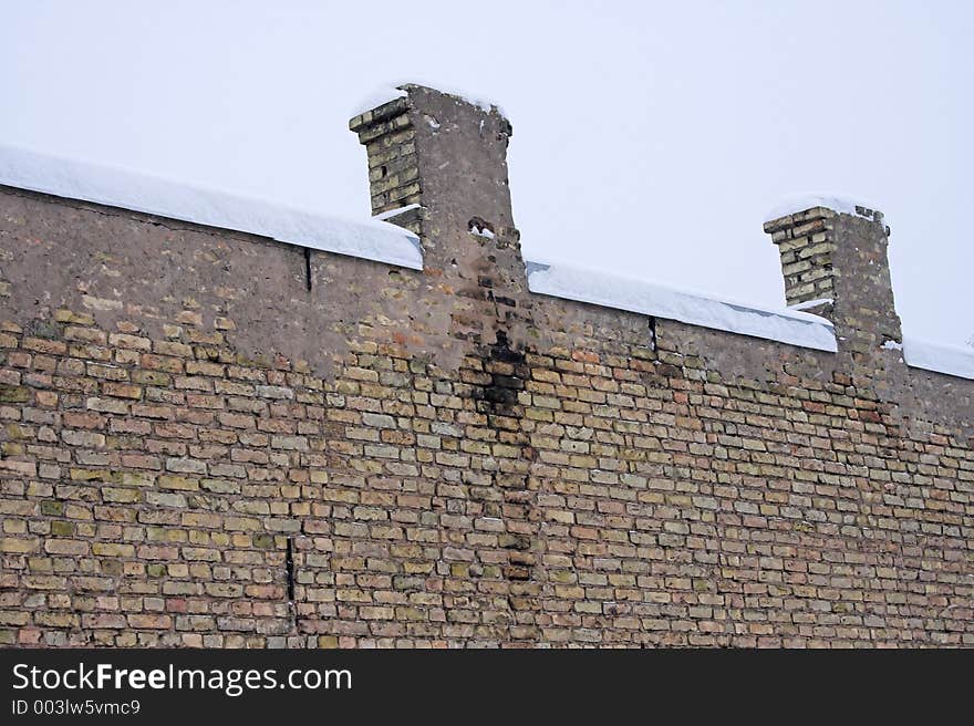 Two pipes on snowy roof