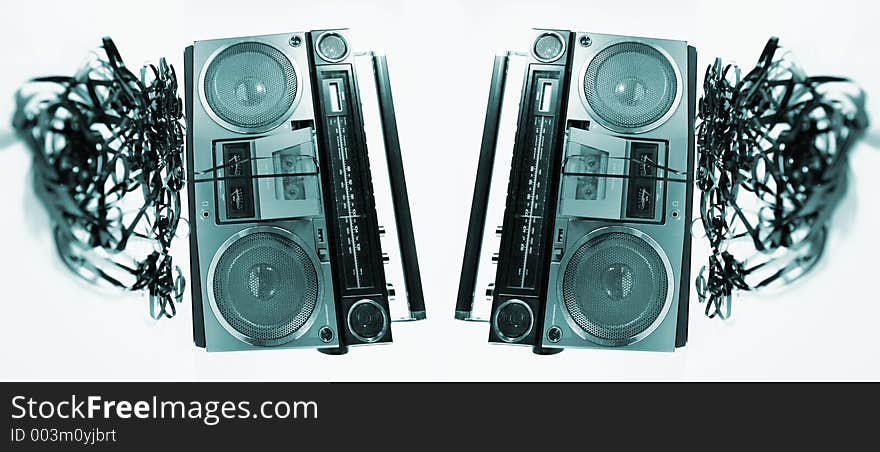 Cassette tape spewing out of a retro ghettoblaster. Cassette tape spewing out of a retro ghettoblaster