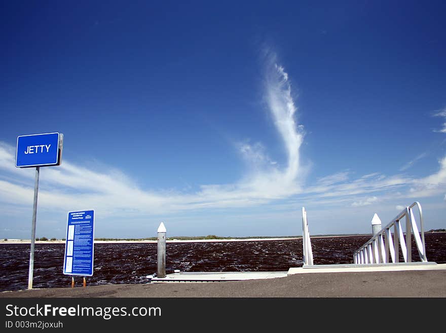 An unusual cloud formation where it is stretching up vertically. Taken by a jetty on the Sunshine Coast Australia. An unusual cloud formation where it is stretching up vertically. Taken by a jetty on the Sunshine Coast Australia