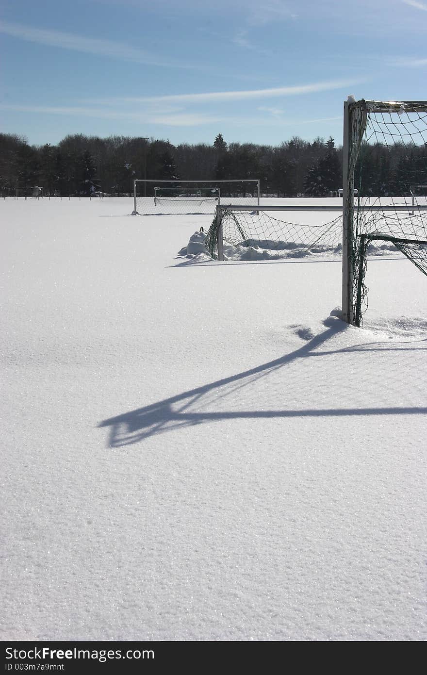 Snow covered soccer-field with goals. Snow covered soccer-field with goals