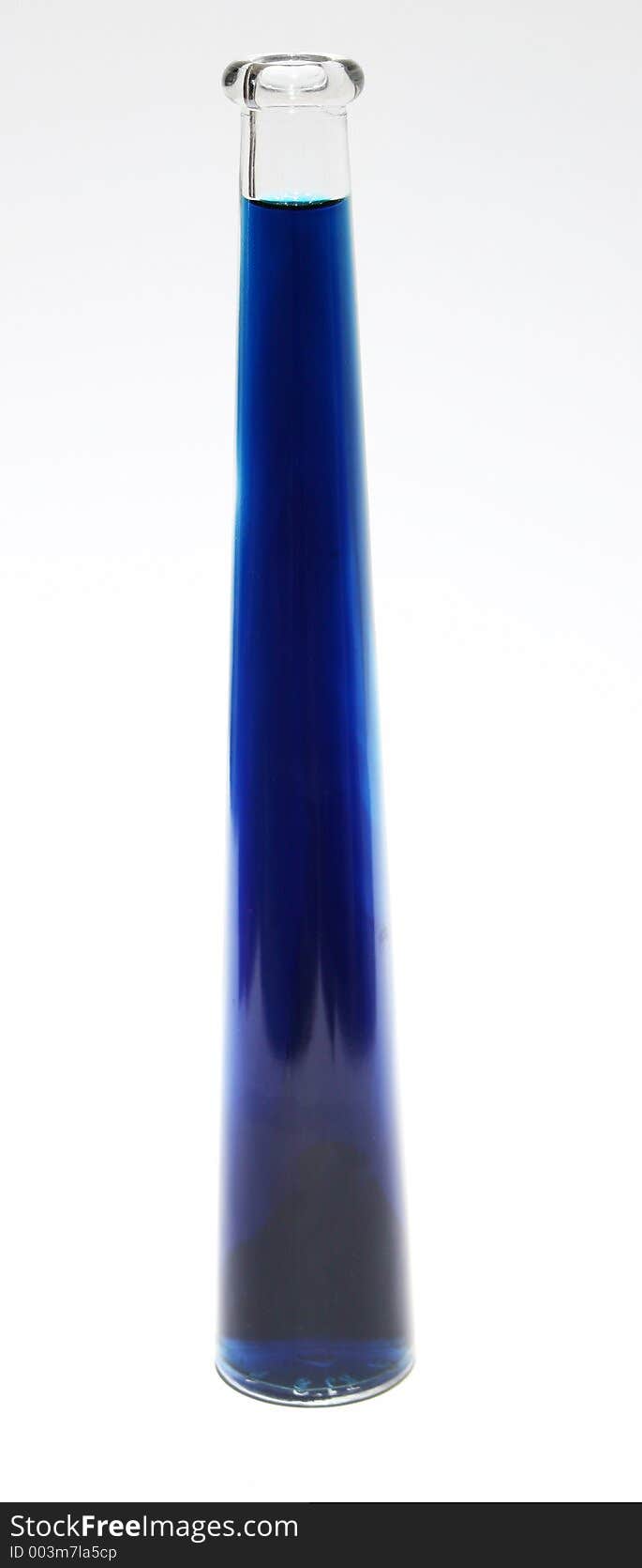 A bottle filled with blue liquid. A bottle filled with blue liquid