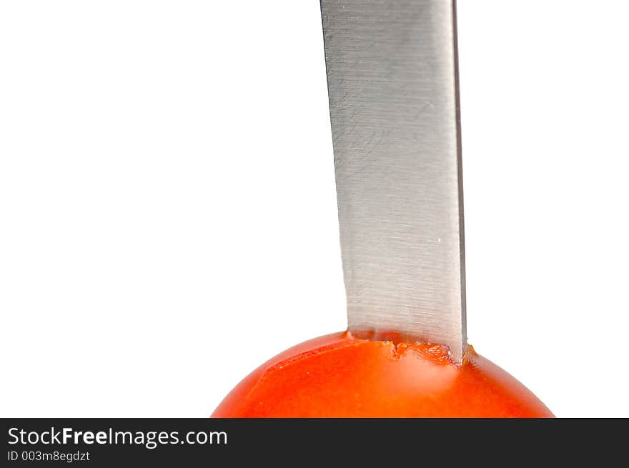 Blade stuck in a tomato. Blade stuck in a tomato