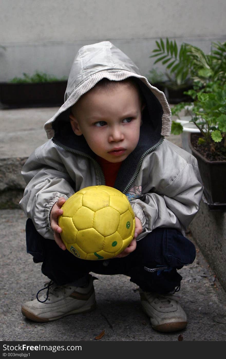 Boy with yellow ball