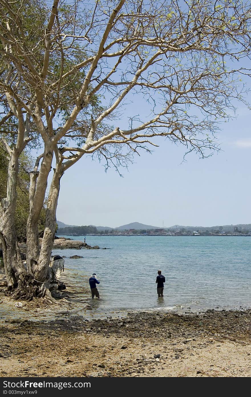 Two People Fishing Location: Pattaya, Thailand.