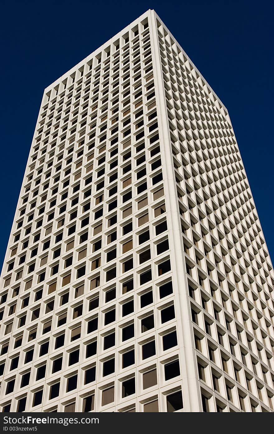 A skyscraper in San Francisco against a blue sky. A skyscraper in San Francisco against a blue sky