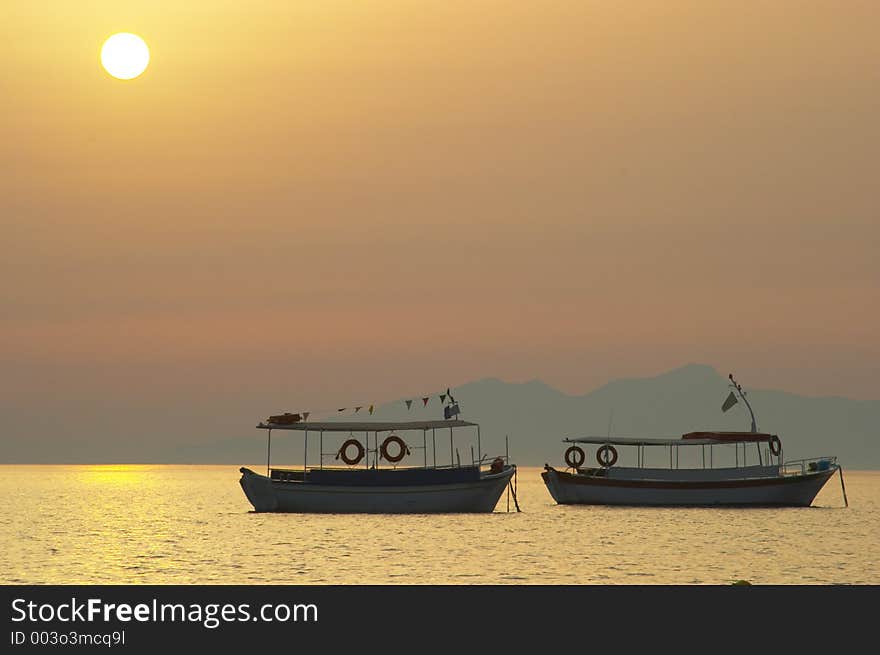 Boat silhouette at sunrise