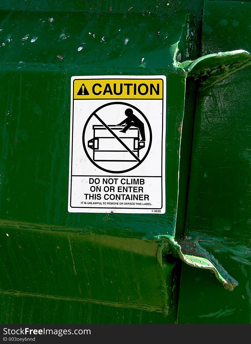 Warning on metal bin. Warning on metal bin