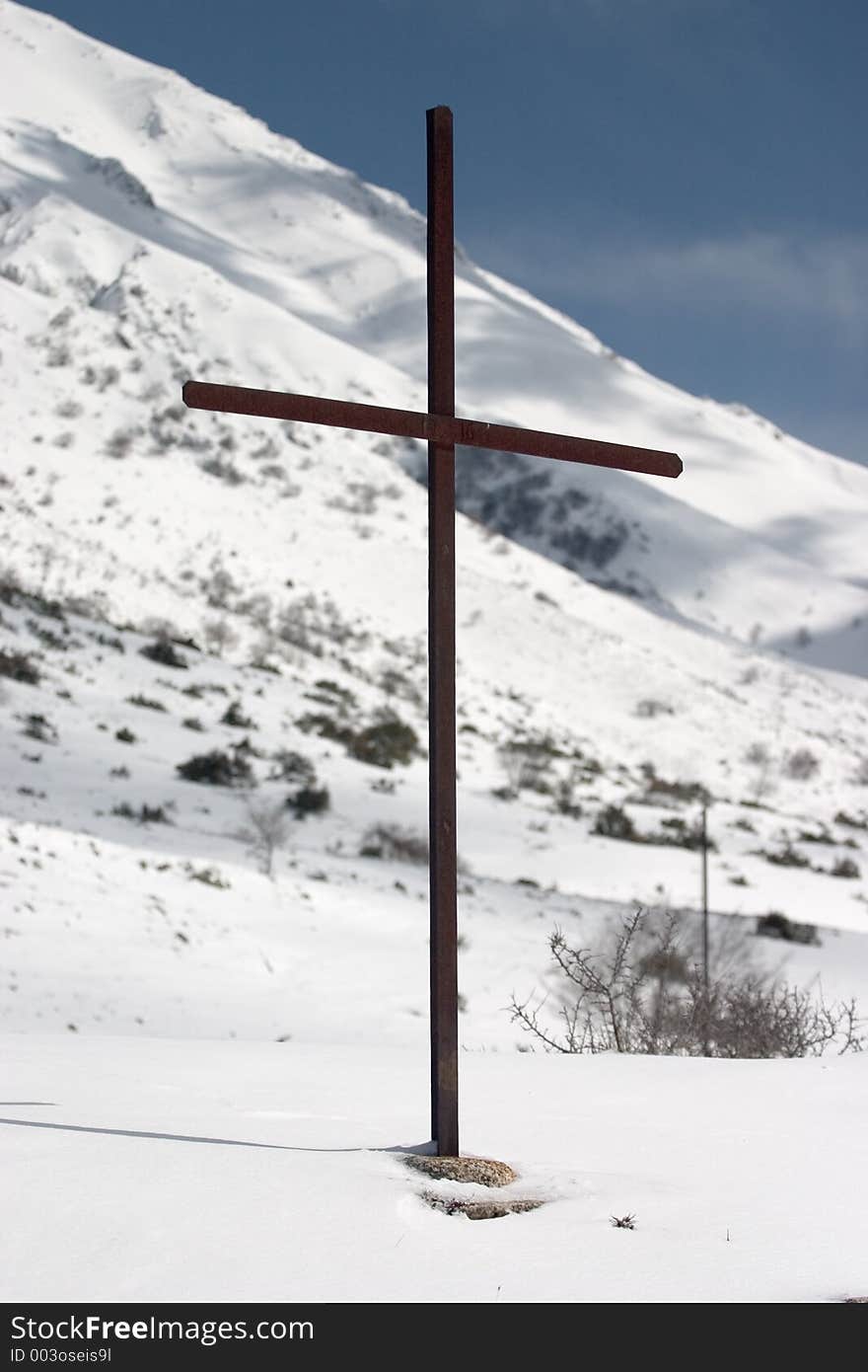 Latin cross on snow