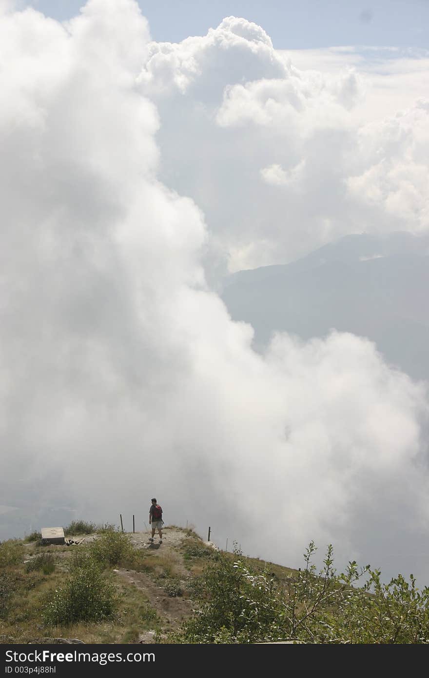 Guy walking among the clouds