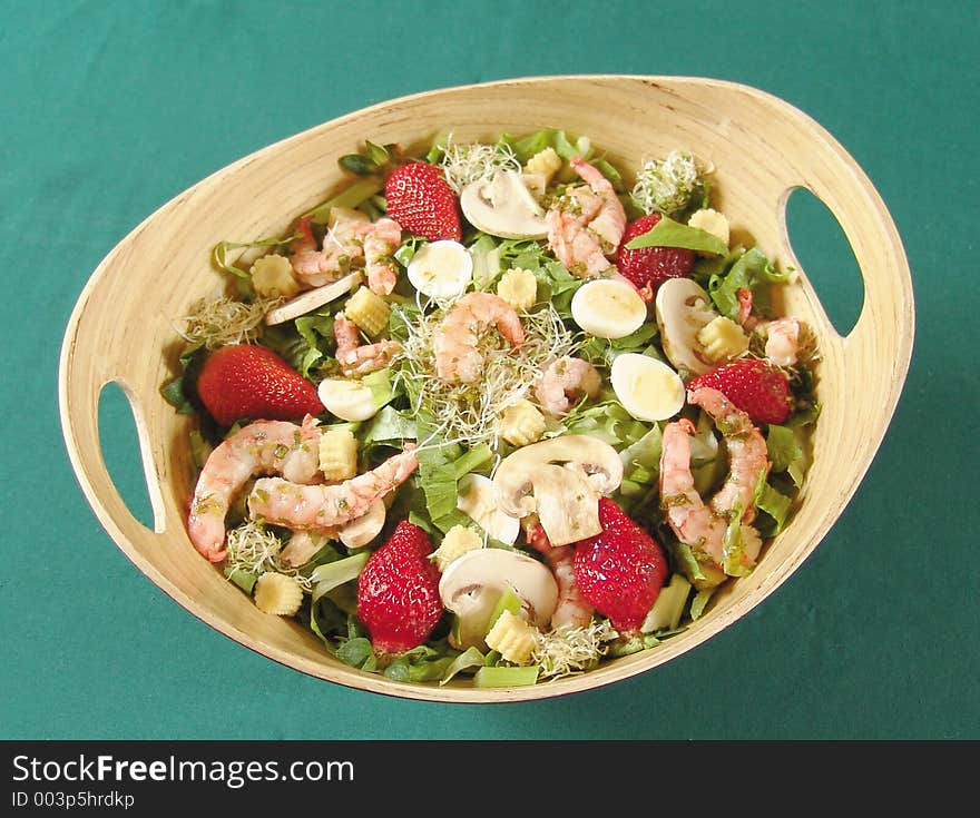 Mixed salad with shrimps, mushrooms and strawberries. Mixed salad with shrimps, mushrooms and strawberries