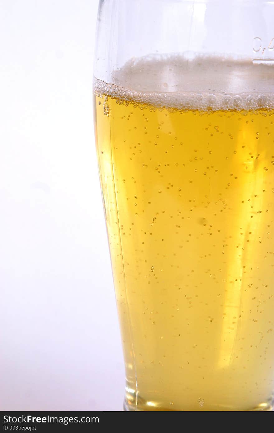 A freshly poured glass of beer. A freshly poured glass of beer.