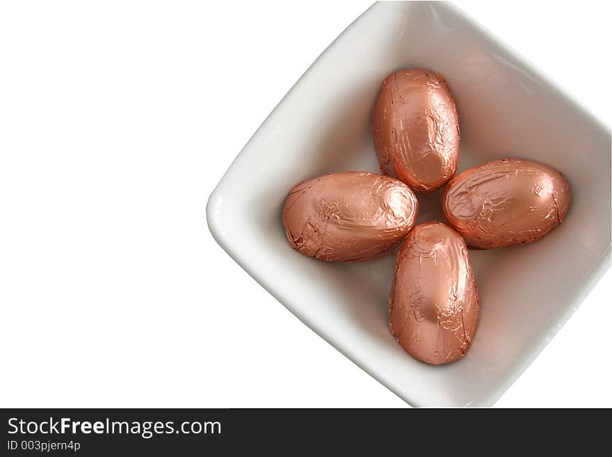 Foil covered candy in a square dish