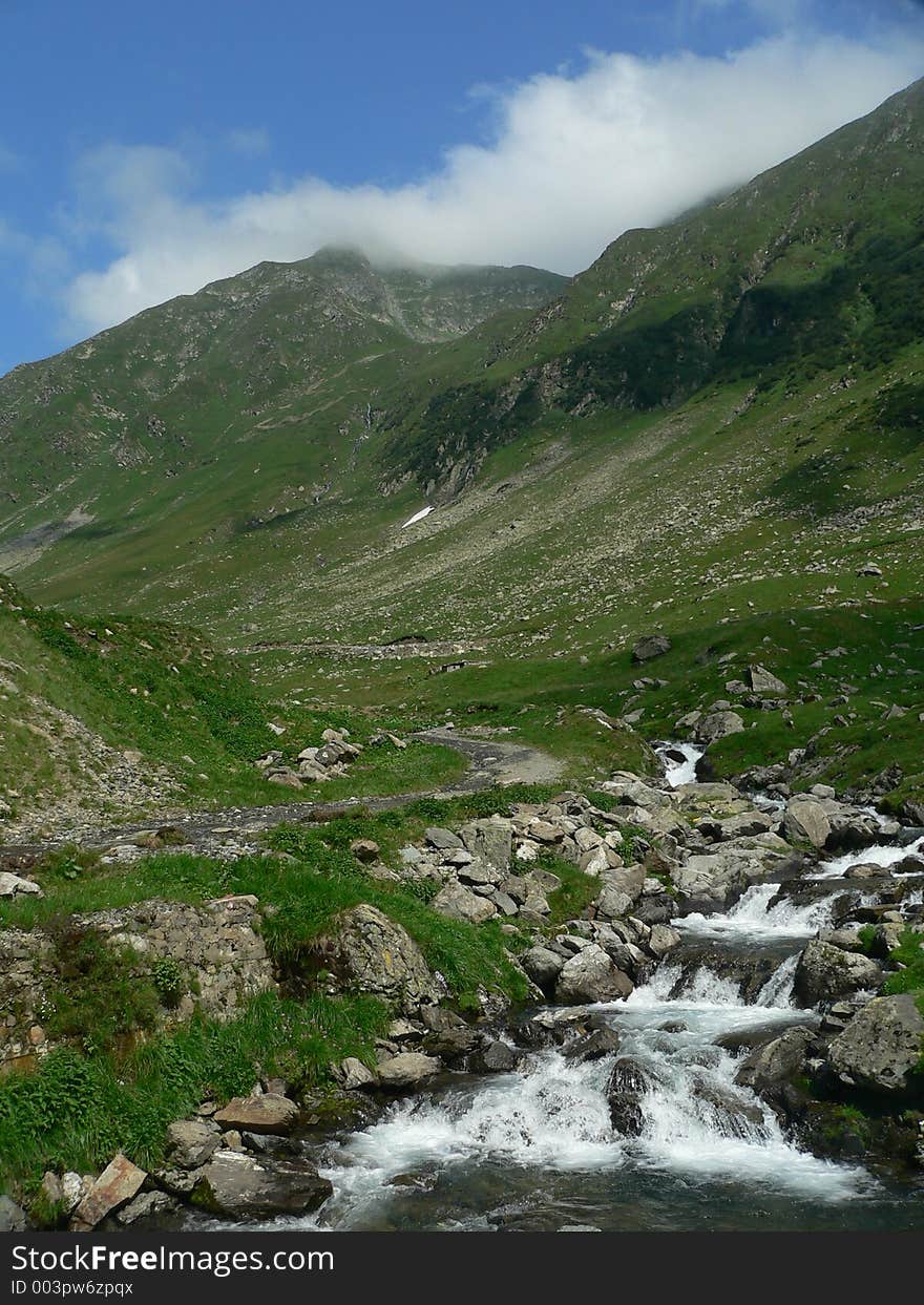 Mountain lanscape with a river in the fore plan. Mountain lanscape with a river in the fore plan