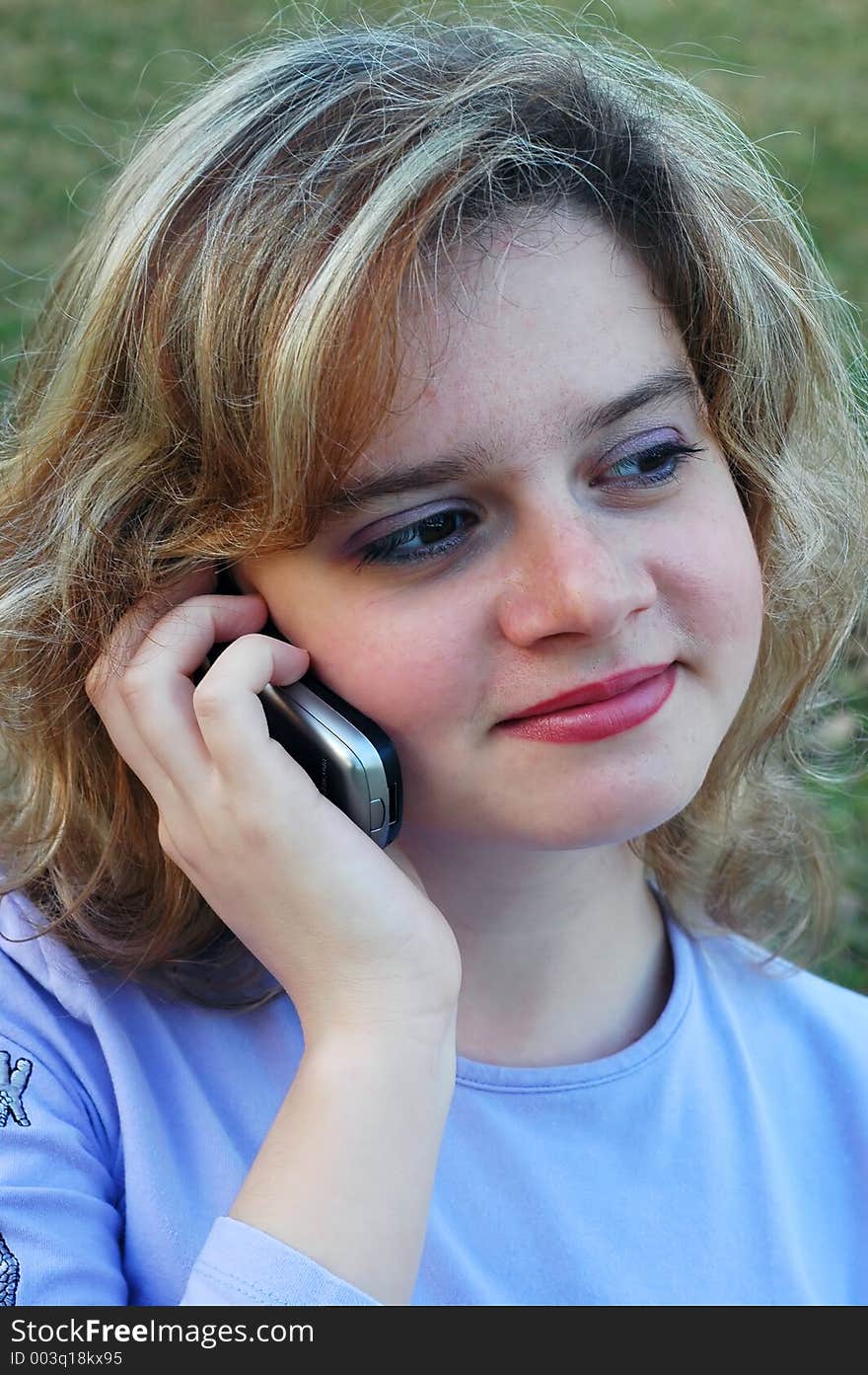 Attractive girl having a phone conversation. Attractive girl having a phone conversation