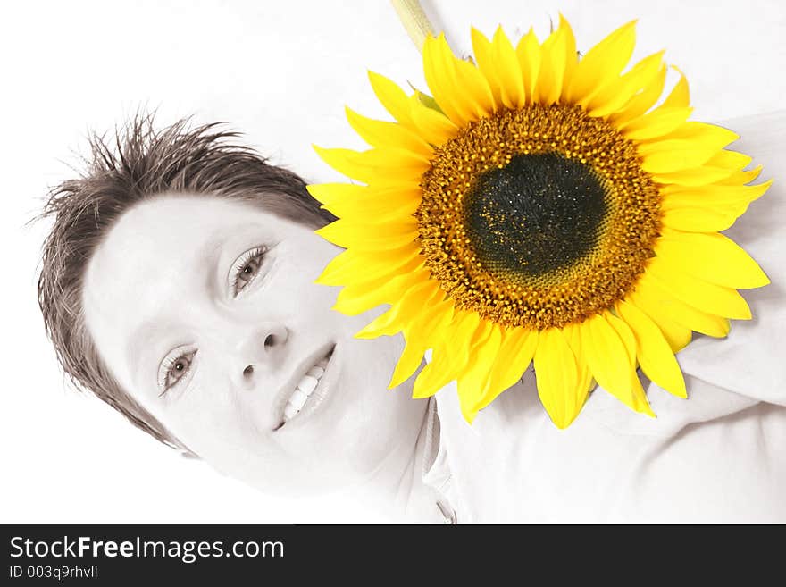 Close up of a woman's face and a sunflower. Close up of a woman's face and a sunflower