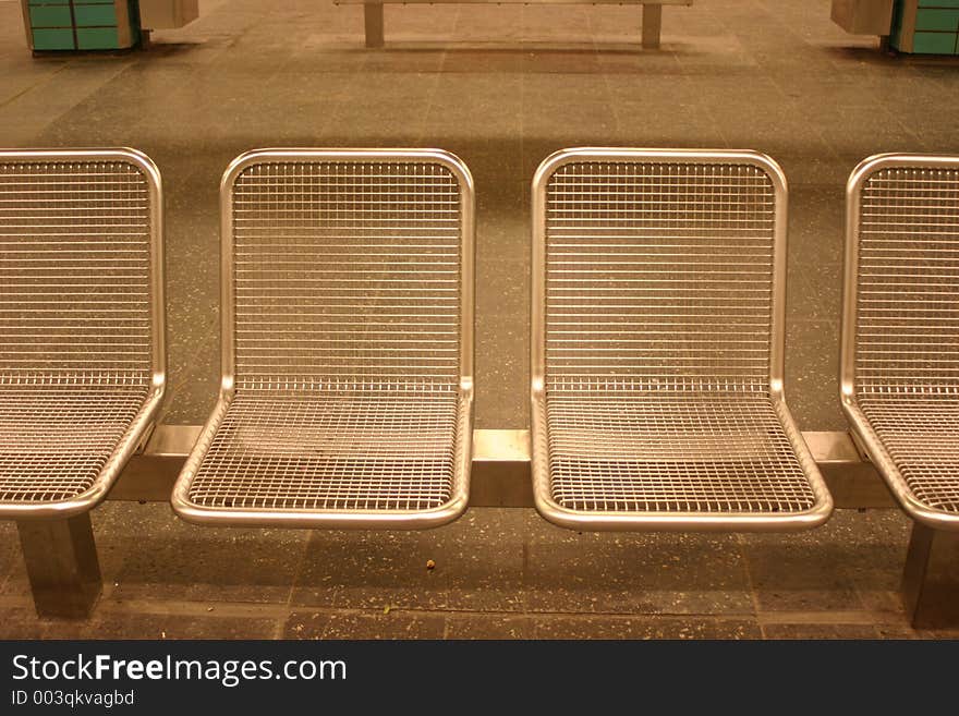 Chairs in a subway stationin berlin. Chairs in a subway stationin berlin