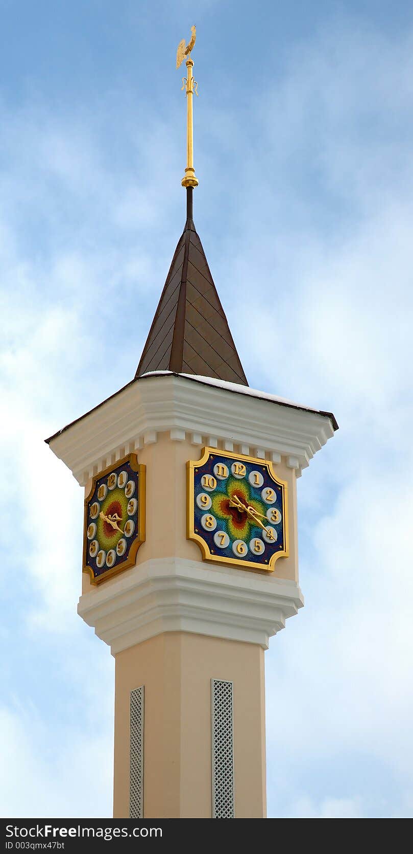 Clock tower with a weathercock