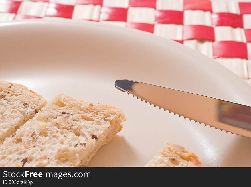 Bread in plate over white