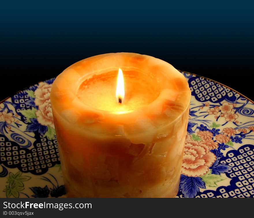 Candle on China Plate