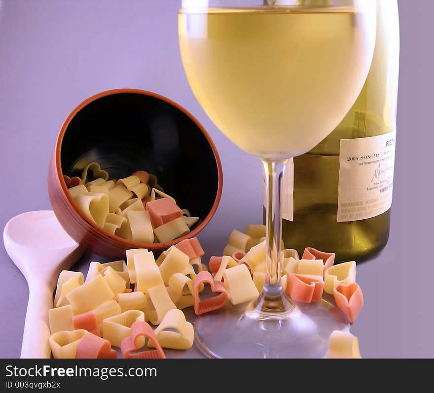 Heart shaped valentine pasta noodles with chardonnay wine. Heart shaped valentine pasta noodles with chardonnay wine