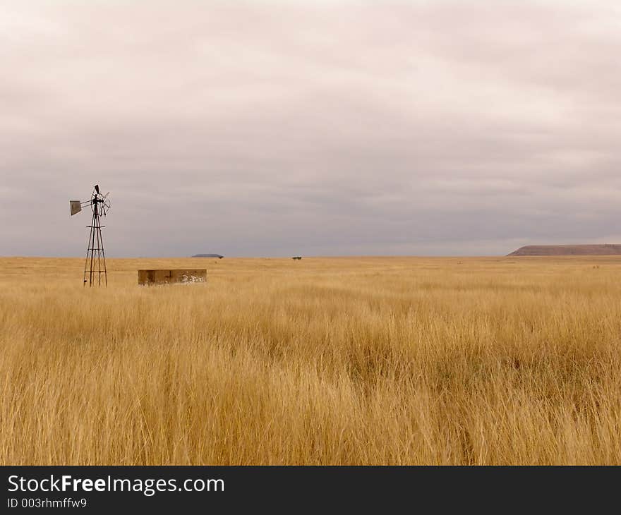 Broken Water Pump in a field. Broken Water Pump in a field