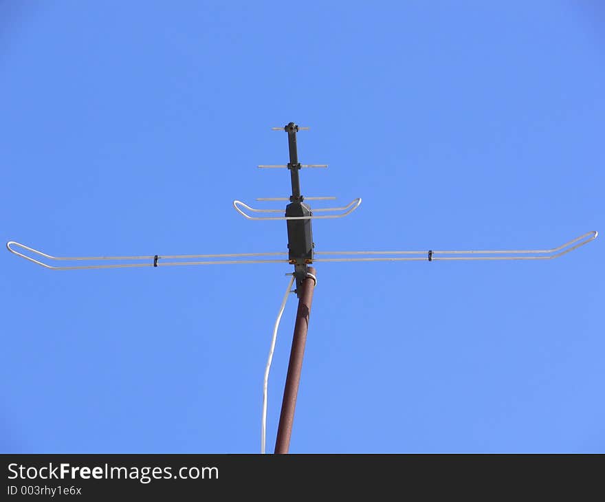 Antenna on blue sky background.