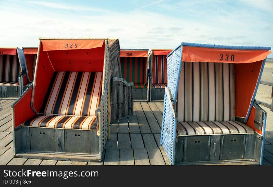 Beach-chairs are waiting for guests. Beach-chairs are waiting for guests.