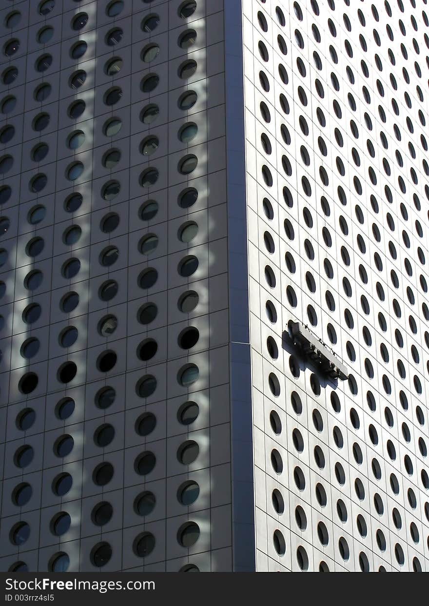 Cleaning trolley against building