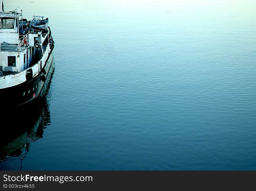 Rusty ship on the bank of Danube. Sort of a timeless bookmark, reminding us of the past decades, wealth and power. Rusty ship on the bank of Danube. Sort of a timeless bookmark, reminding us of the past decades, wealth and power.