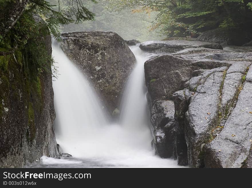 Water flowing through rocks. Water flowing through rocks.