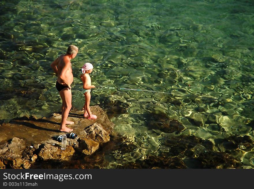 Grandad and grandson fishing. Grandad and grandson fishing