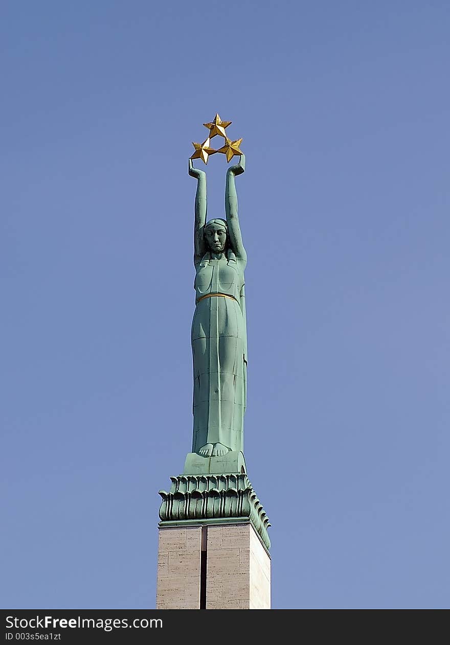 Statue of liberty in Riga dedicated To Fatherland and Freedom. The Monument was executed by Kârlis Zâle (1888-1942), a well-known Latvian sculptor. Ernests Shtalbergs was the architect . The monument is topped by a Liberty Statue, a woman with three stars symbolizing regional parts of Latvia: Kurzeme, Vidzeme and Latgale.