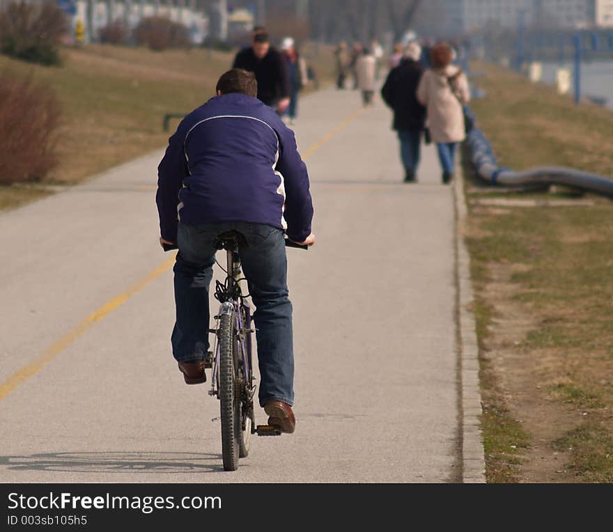 Bicyclist On Promenade