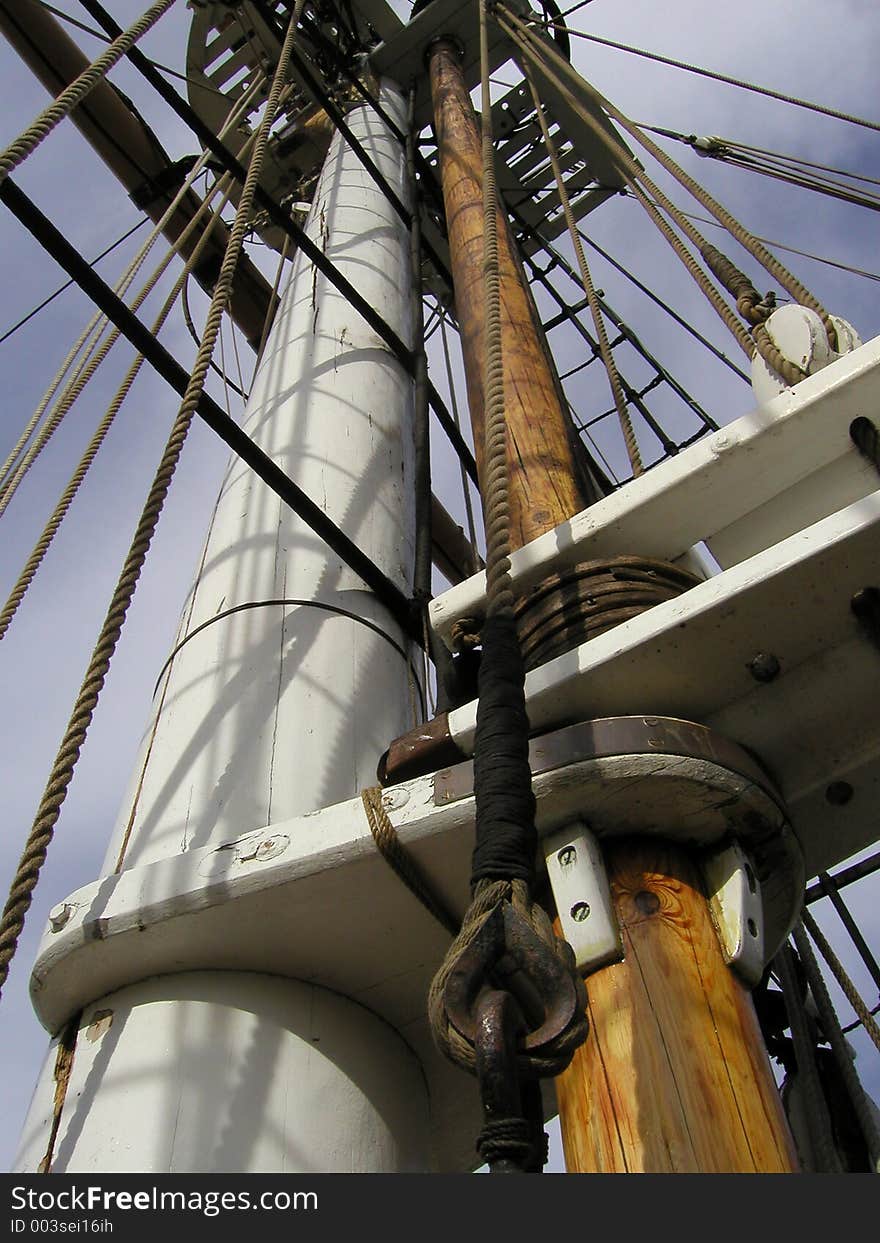 Historic wooden sailboat mast and rigging. Historic wooden sailboat mast and rigging