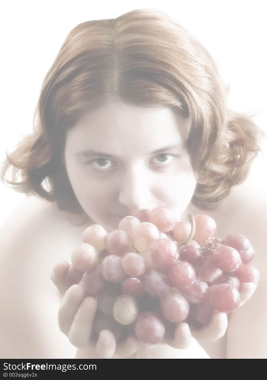 Girl with bunch of grapes