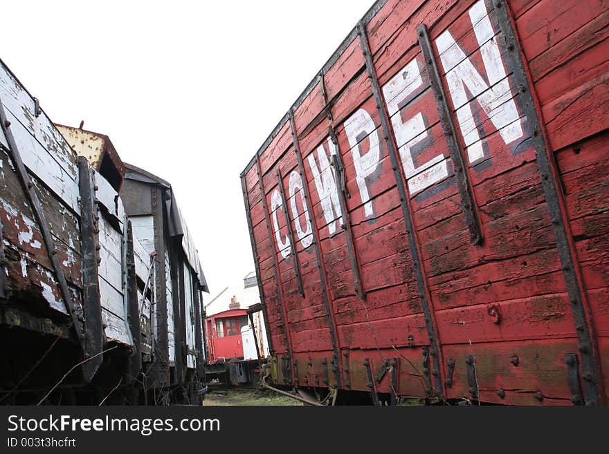 A train carriage with the words cow pen on the side. A train carriage with the words cow pen on the side