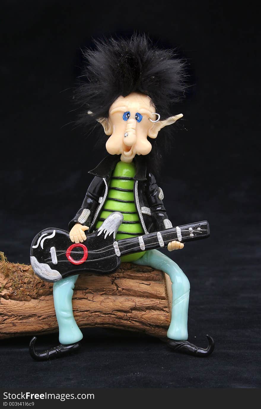 Rocker dwarf playing the guitar