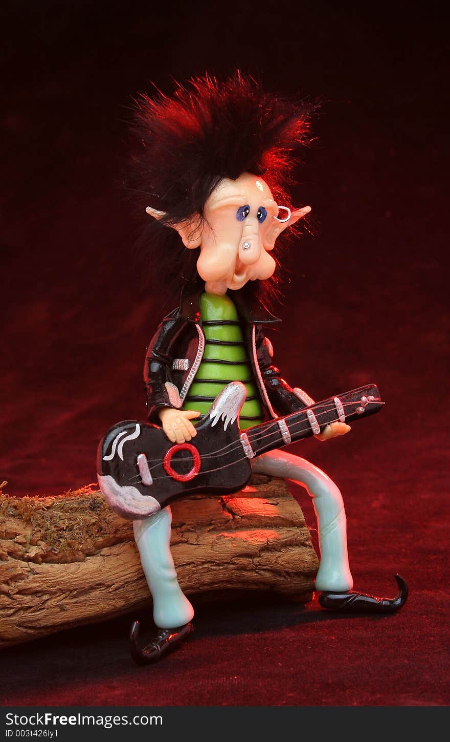 Rocker dwarf playing the guitar