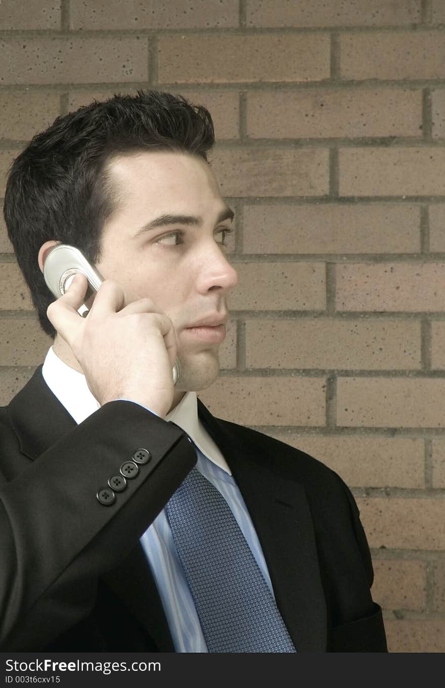 A gentleman holds a mobile telephone and gets news that is surprising and startling. This may be the start of something big.