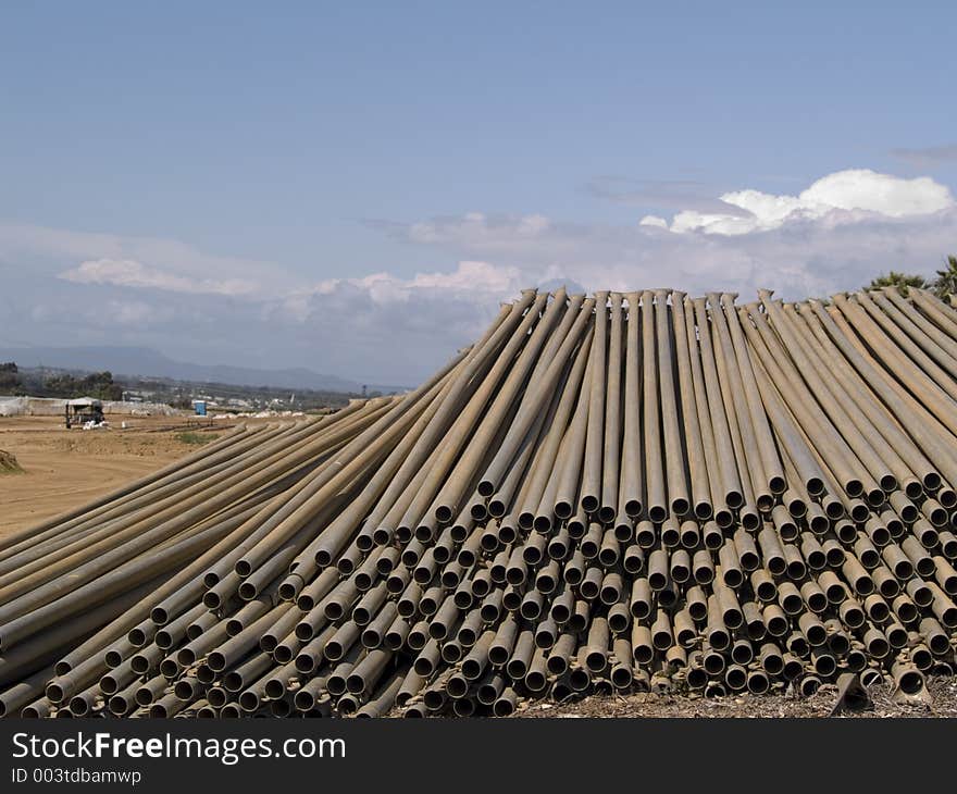 Long shot of metal irrigation pipes. Long shot of metal irrigation pipes