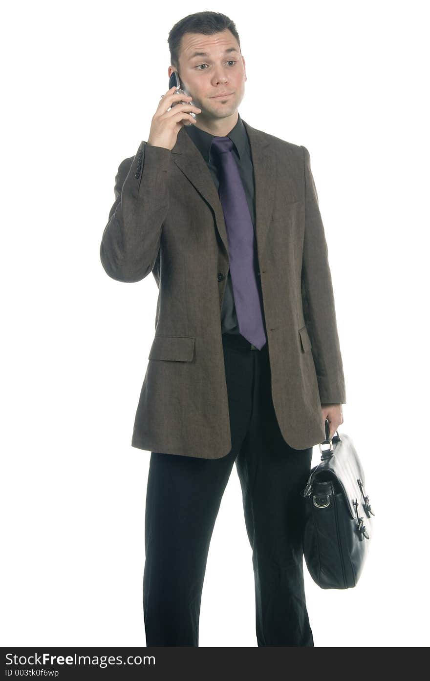 Businessman talking relaxed on his cellphone, isolated on white. Businessman talking relaxed on his cellphone, isolated on white.