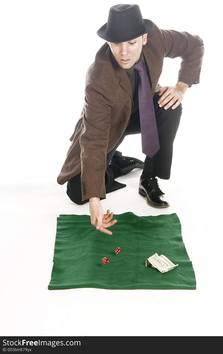 Slick mobster throwing the dice, isolated on white. Slick mobster throwing the dice, isolated on white