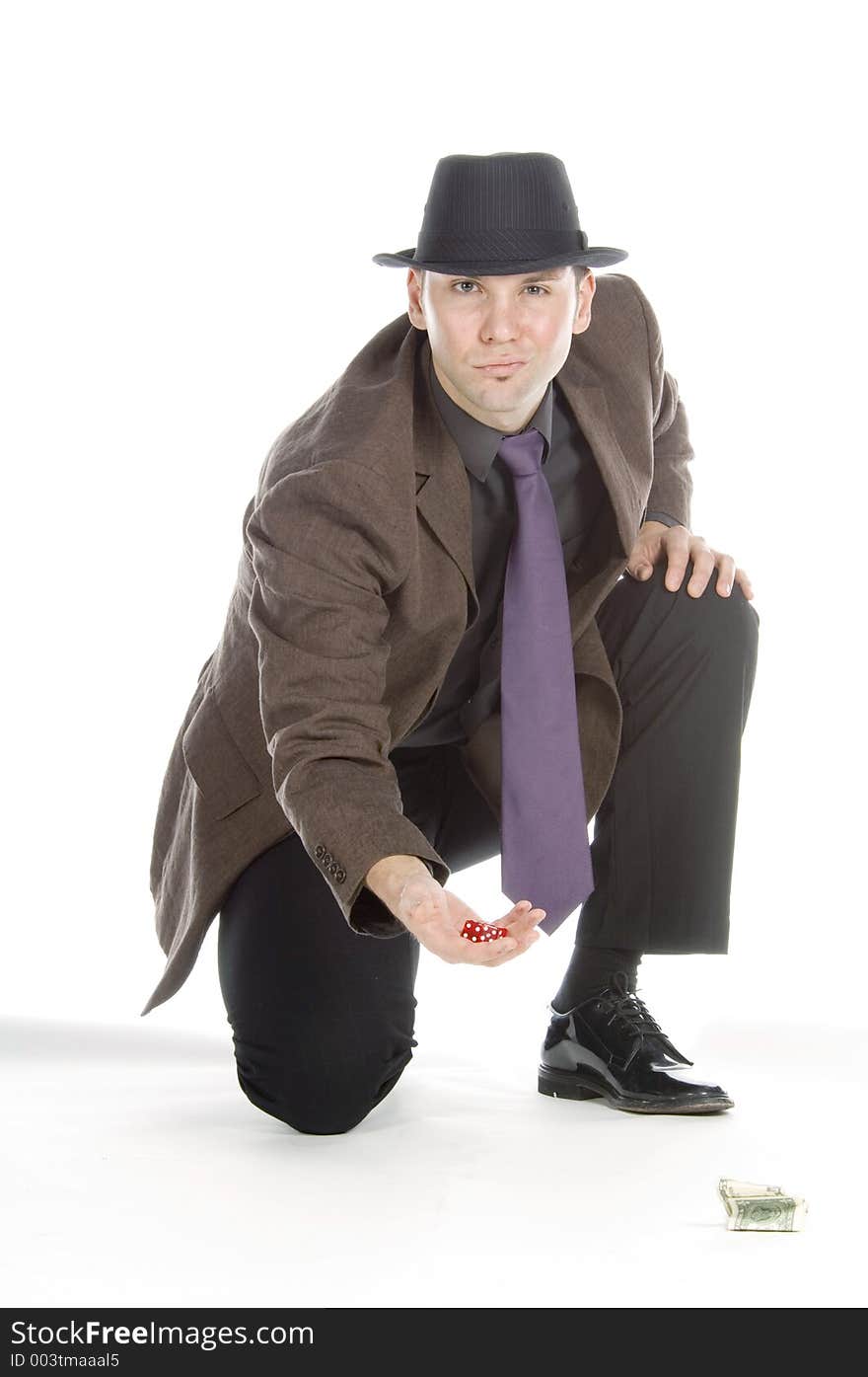 Slick mobster throwing the dice, isolated on white. Slick mobster throwing the dice, isolated on white