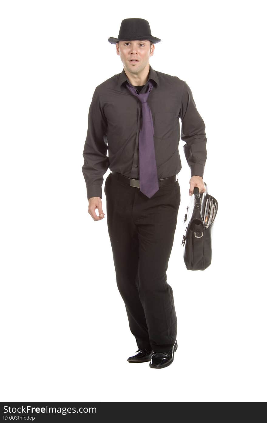 Young, attractive male model dressed soberly on tie, hat and briefcase simulates running after the cab. Young, attractive male model dressed soberly on tie, hat and briefcase simulates running after the cab