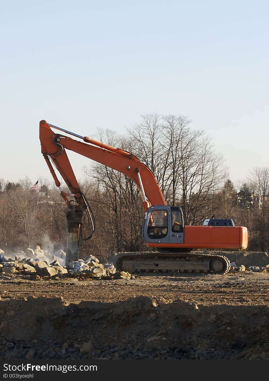 Excavator breaking Rocks