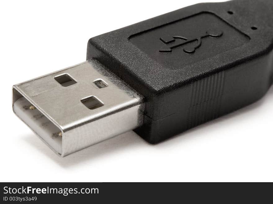 Macro shot of a black USB plug. Isolated against white. Macro shot of a black USB plug. Isolated against white.