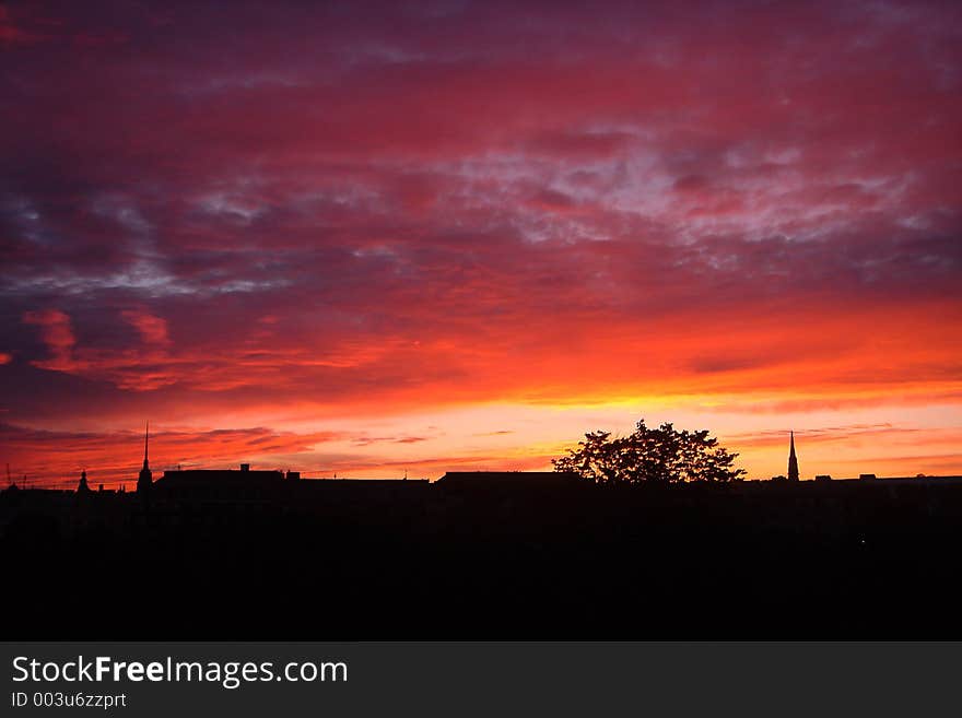 Sunset above city